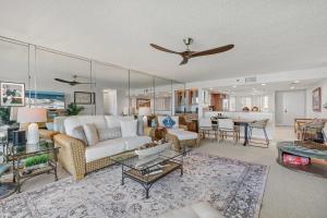 a living room with a couch and a table at Inlet at Minorca 904 in New Smyrna Beach