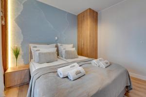 Posteľ alebo postele v izbe v ubytovaní Merwede Residence - 100 metrów od plaży by Downtown Apartments