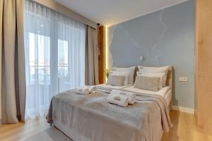 Posteľ alebo postele v izbe v ubytovaní Merwede Residence - 100 metrów od plaży by Downtown Apartments