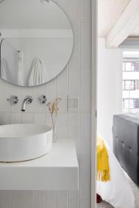 a bathroom with a sink and a mirror at Casa Cima in Ushuaia +207 photos