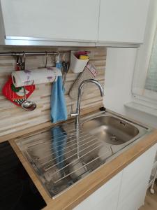 a kitchen counter with a sink and a sink at Zovetto Holidays in Genova