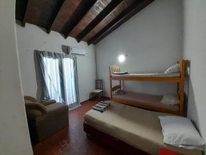 Rúm í herbergi á Hospedaje Quintana
