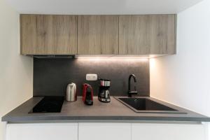 a kitchen with a sink and a counter top at Summer Sense, New Private Retreat with Private Pool, Agia Anna, Naxos in Agia Anna