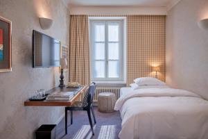 Uma cama ou camas num quarto em Hotel Kindli