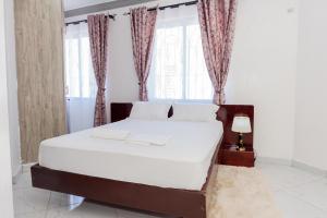 Postel nebo postele na pokoji v ubytování Upmax Cosy Home