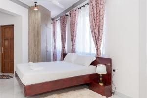 Postel nebo postele na pokoji v ubytování Upmax Cosy Home