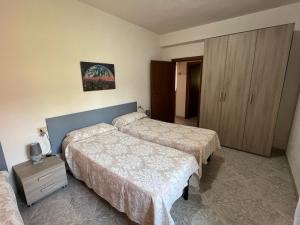 Voodi või voodid majutusasutuse Appartamenti Lucry toas