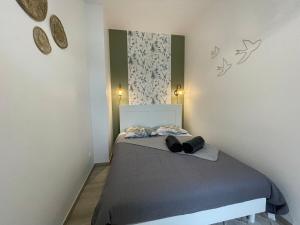 Postel nebo postele na pokoji v ubytování Le familial proche gare + 2 fotografie