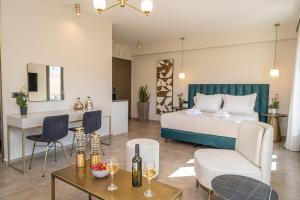a bedroom with a bed and a living room at PERATZADA central suite in Argostoli +28 photos