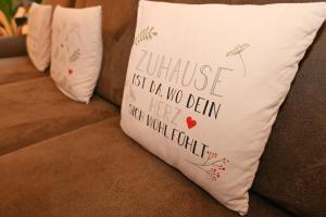 a pillow that saysurance isnt no design but your moral fault at Suite Sand-Düne in Warnemünde