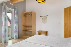 Postel nebo postele na pokoji v ubytování Christines Ferienwohnung