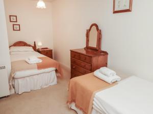 Voodi või voodid majutusasutuse Freesia Cottage toas +38 fotot