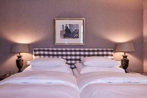 Uma cama ou camas num quarto em Hotel Kindli