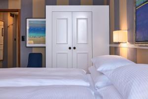 Uma cama ou camas num quarto em Hotel Kindli