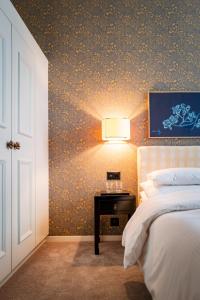 Uma cama ou camas num quarto em Hotel Kindli