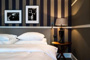 Uma cama ou camas num quarto em Hotel Kindli