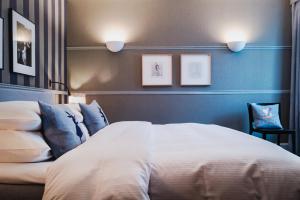 Uma cama ou camas num quarto em Hotel Kindli