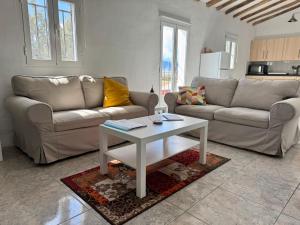 a living room with a couch and a table at casa de lucas in Caniles