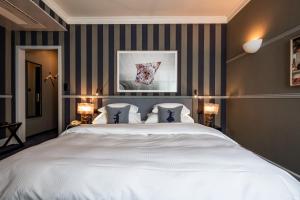 Uma cama ou camas num quarto em Hotel Kindli