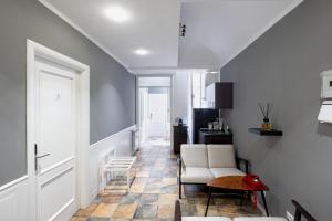 a living room with two chairs and a table at My Tiny Home Alchemy in Rome +25 photos