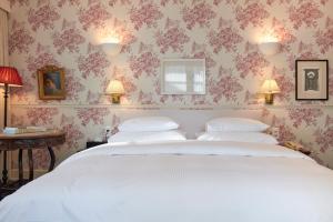 Uma cama ou camas num quarto em Hotel Kindli