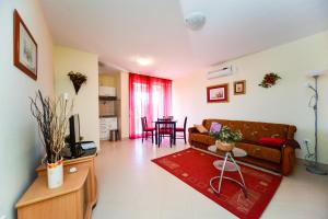 a living room with a couch and a table at Apartments Ivan in Zadar