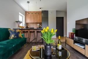 Televízia a/alebo spoločenská miestnosť v ubytovaní Lumina premium apartments for a family