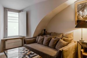 a living room with a couch and a window at Piazza Navona Luxury Loft in Rome