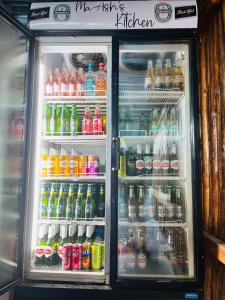 an open refrigerator filled with lots of drinks at Ashridge Guesthouse & Safaris in Hazyview +100 photos