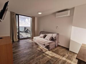TV a/nebo společenská místnost v ubytování Village de vacances Paese di Lava, Grand Ajaccio