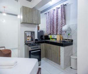 Kuchyň nebo kuchyňský kout v ubytování Upmax Cosy Home