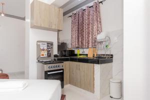 Kuchyň nebo kuchyňský kout v ubytování Upmax Cosy Home