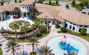 an aerial view of a house with a pool and a resort at Wonderful Villas 18 Minutes away from Disney! in Kissimmee