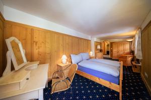 Postel nebo postele na pokoji v ubytování Albergo Ristorante Grotto Miralago