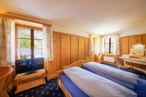Postel nebo postele na pokoji v ubytování Albergo Ristorante Grotto Miralago