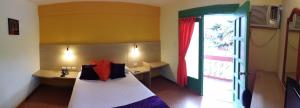 Rúm í herbergi á Hosteria Canoa