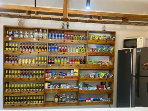 a store with a lot of drinks and a refrigerator at Hotel Don Pacho in Los Andes +5 photos
