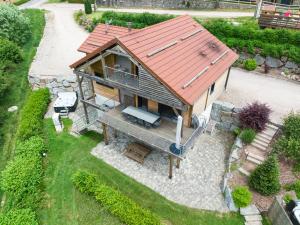 an overhead view of a house with a red roof at Chalet LES BICHES LUCY in Gérardmer