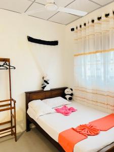Postel nebo postele na pokoji v ubytování R Villa Unawatuna
