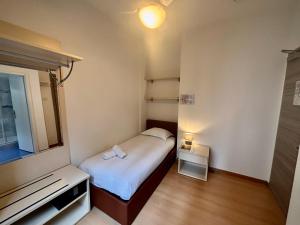 Postel nebo postele na pokoji v ubytování Hotel Locanda Castagnola