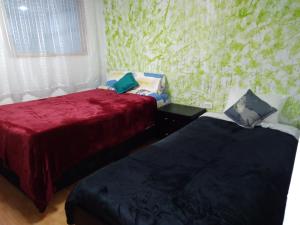 Ένα ή περισσότερα κρεβάτια σε δωμάτιο στο Apartaestudio 90