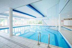 a large swimming pool in a large building at Waddenhuyske in Hollum