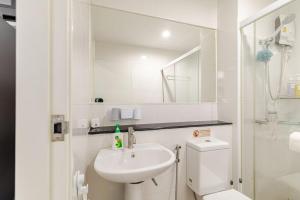 a white bathroom with a toilet and a sink at Perfect 1BR at MRT Bangson By Orn in Bang Su +21 photos