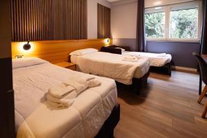 Postel nebo postele na pokoji v ubytování Scheppers Hotel