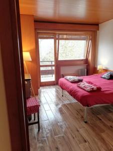 Katil atau katil-katil dalam bilik di Relax tra i monti di Pescasseroli