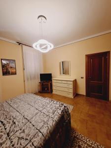 Letto o letti in una camera di Casa Luciana - Comfort a Lucca con Parcheggio
