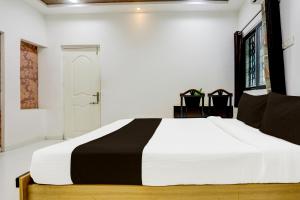 Postel nebo postele na pokoji v ubytování Hotel O GREEN PALMS + 21 fotografií