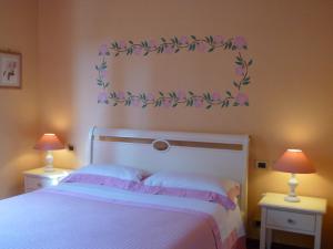 A bed or beds in a room at Locanda Fuoriporta