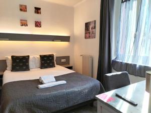 Postel nebo postele na pokoji v ubytování Logis Hôtel La Bastide d'Entraigues