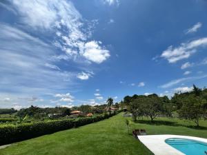 a view of a yard with a swimming pool at Chalet Casa Campestre Villa del Sol in La Tebaida